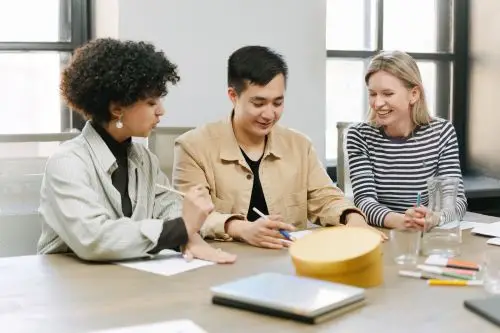 Managers collaborating during a neuroinclusive culture consultancy meeting.