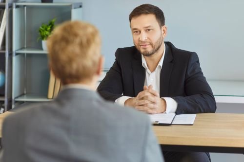 HR manager speaking with a candidate as part of an inclusive recruitment consultancy process.
