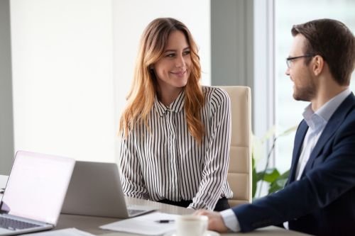 Leadership team reviewing documents during a neurodiversity strategy consultancy session.